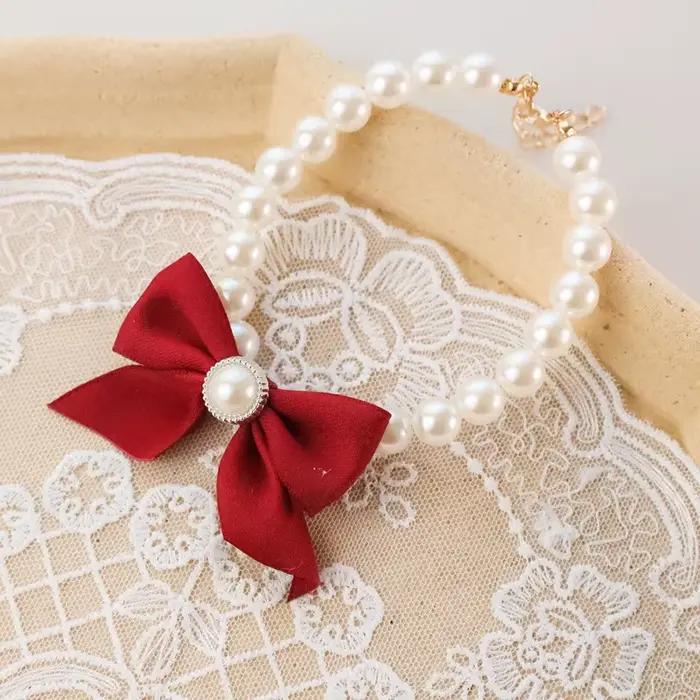 Collier avec nœud en perles pour animaux de compagnie